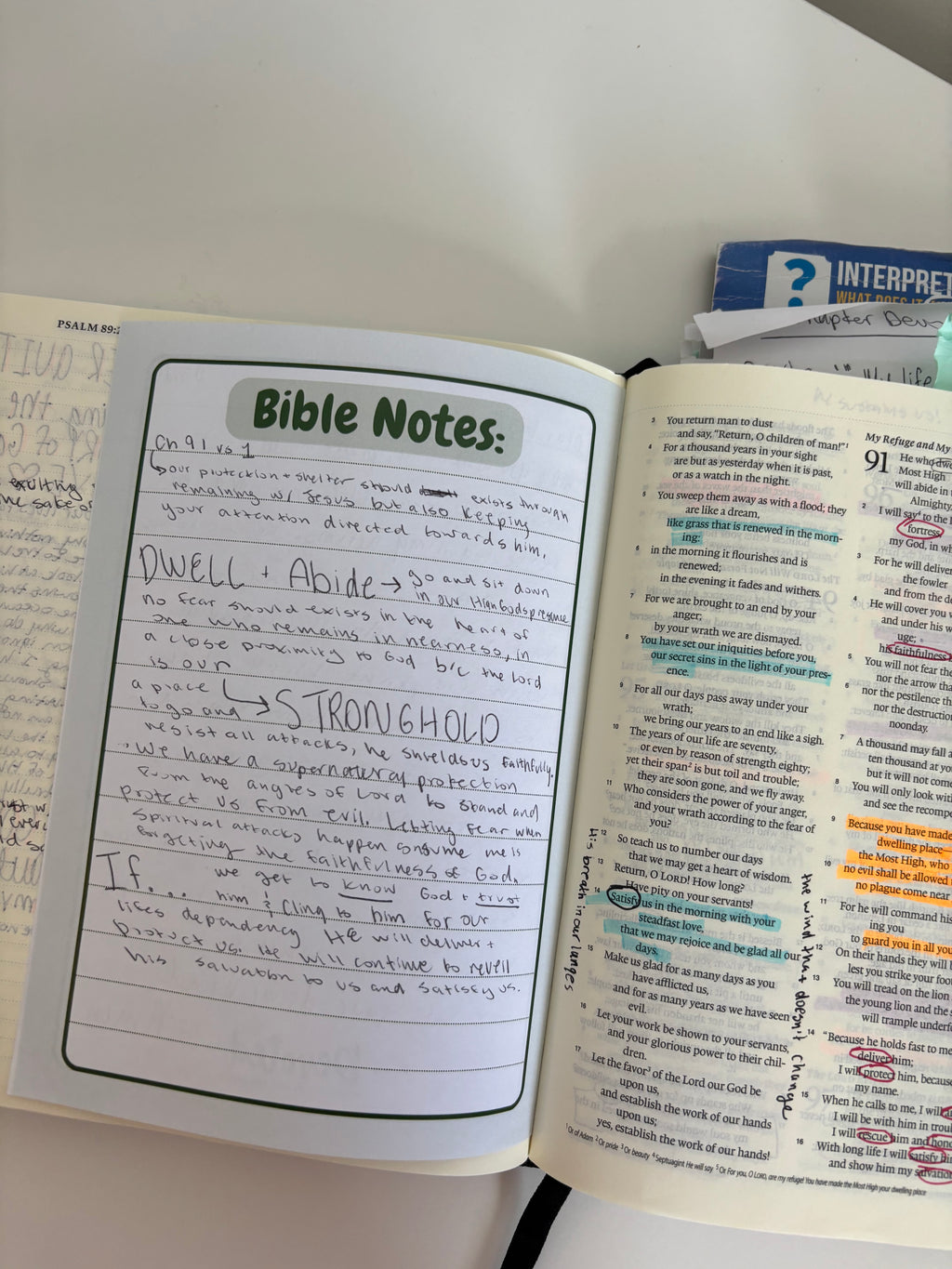 Open Bible with 'Bible Notes' section on a white surface