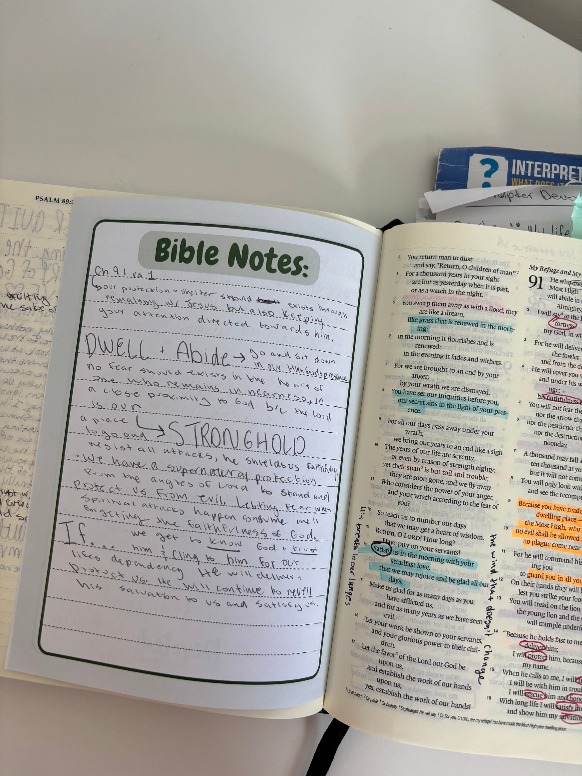 Open Bible with 'Bible Notes' section on a white surface
