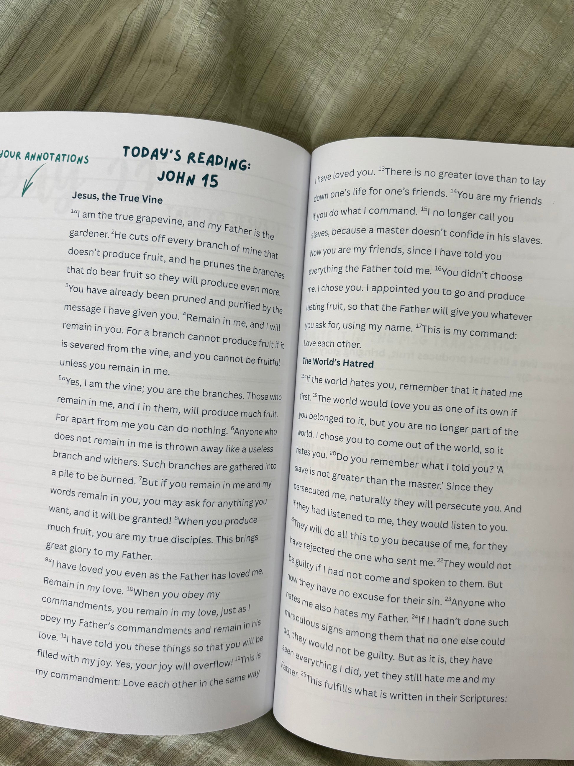 Open book with text on a wooden surface