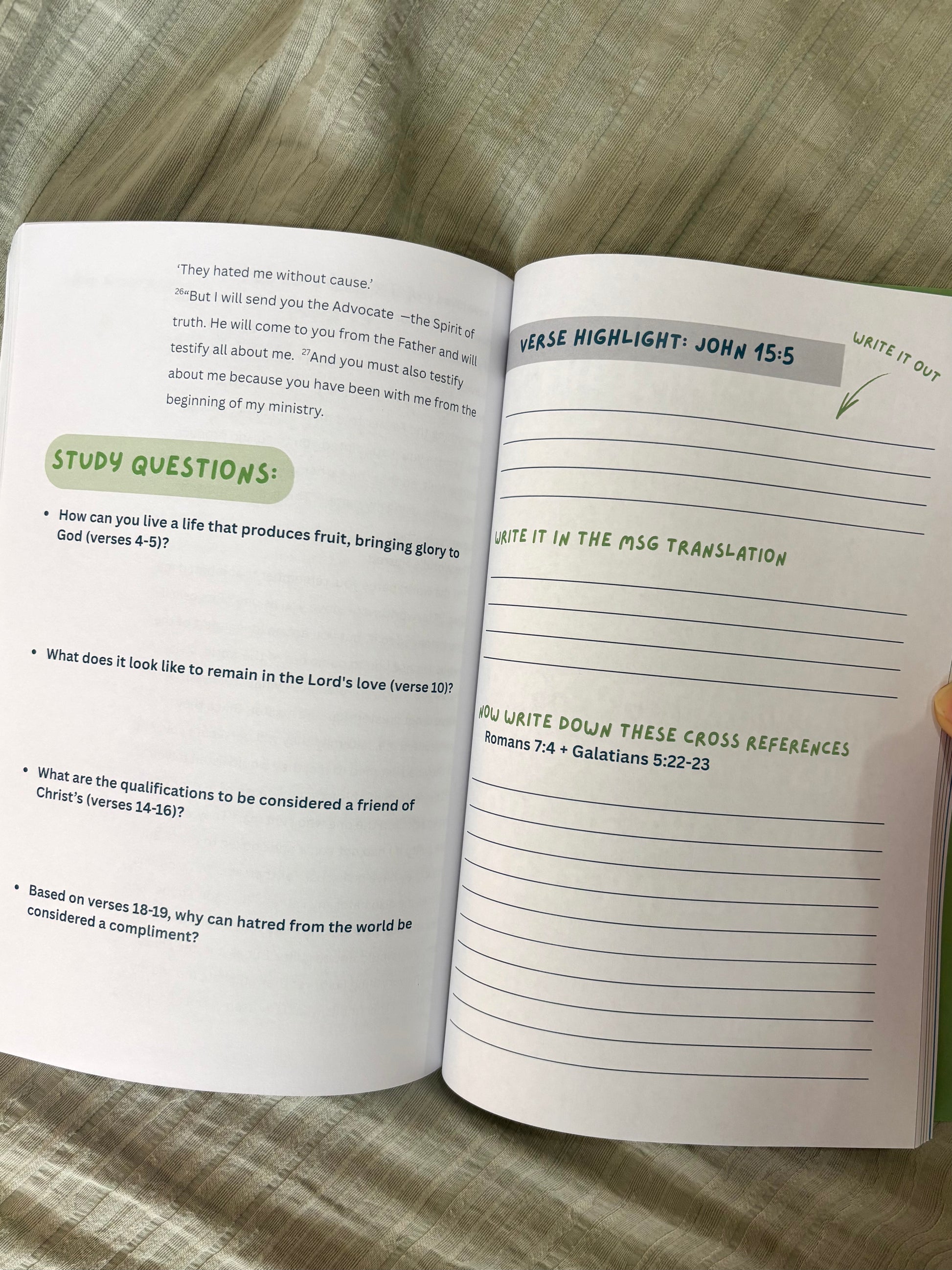 Open book with study questions and highlighted text on a textured surface