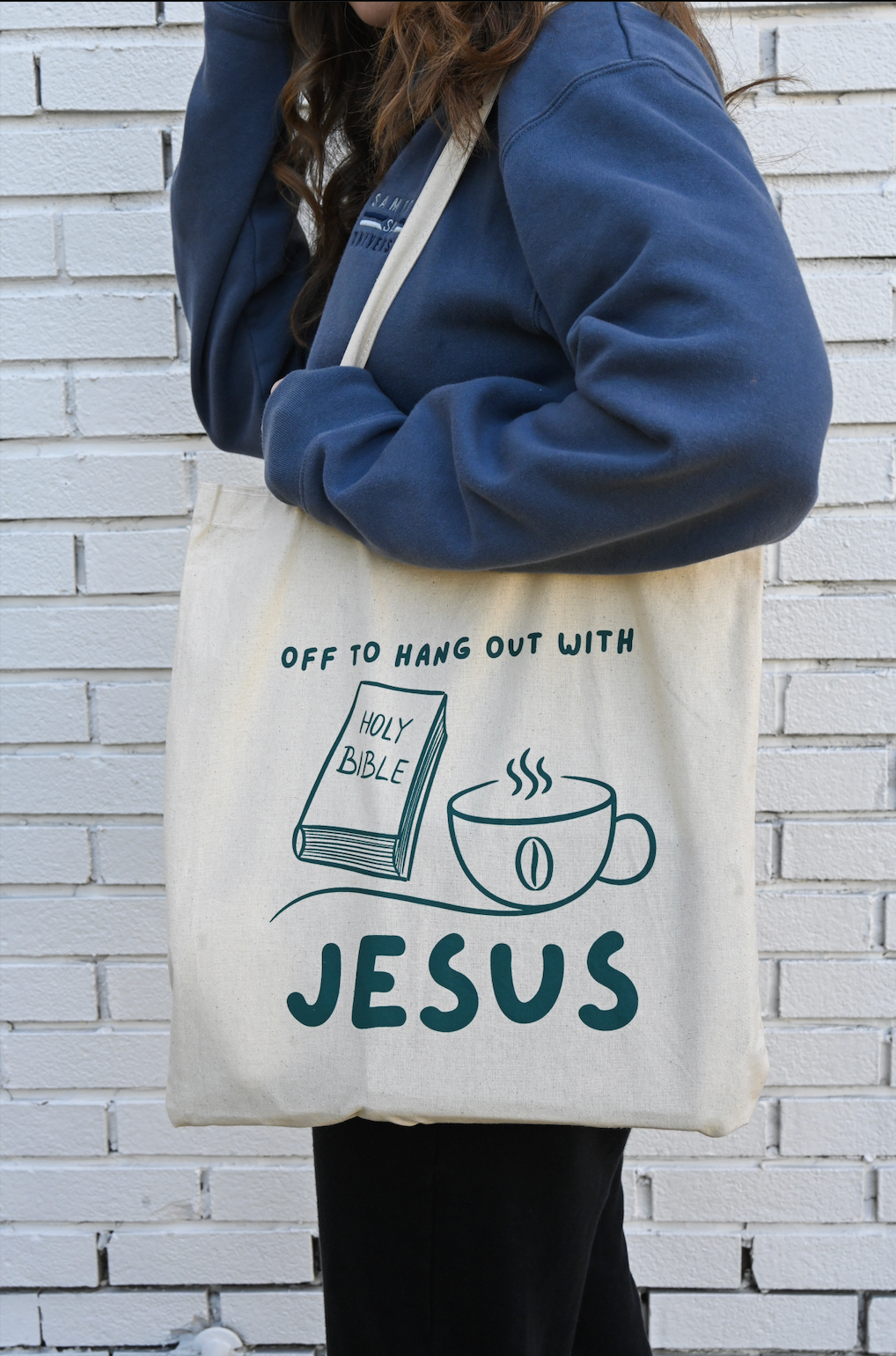 person holding christian tote bag with a bible and coffee cup image 