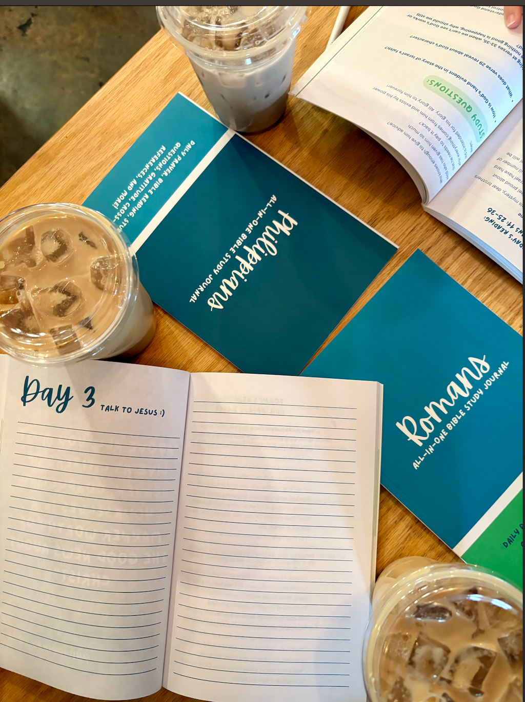 bible study devotional books displayed on a table with coffees